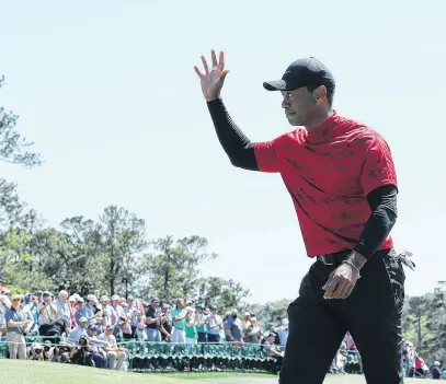  ?? ?? Tiger Woods waves to patrons on the 18th after finishing his final round at The Masters April 10. REUTERS