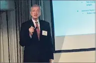  ?? Luther Turmelle / Hearst Connecticu­t Media ?? John Traynor, chief investment officer for Bridgeport-based People’s United Bank, delivers his economic outlook for 2022 on Thursday to members of the Greater New Haven Chamber of Commerce.