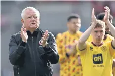  ?? ?? THAT SINKING FEELING: Sheffield United manager Chris Wilder applauds the fans after defeat at Brentford.