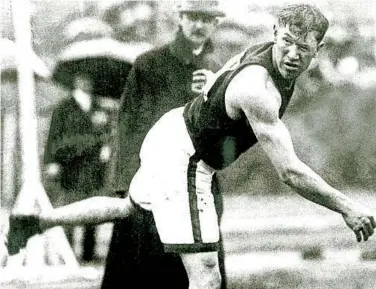  ?? CORBIS ?? Jim Thorpe throws the shot put during the 1912 Olympic Games in Stockholm, where he won two gold medals.