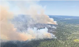  ?? AFP ?? An aerial view of a wildfire southwest of Deka Lake, British Columbia, on Saturday.