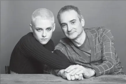  ?? Associated Press ?? Stewart: Kristen Stewart, left, and writer-director Olivier Assayas pose for a portrait to promote their film, "Personal Shopper," on Thursday in New York.