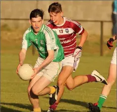  ??  ?? Seamus O’Donnell of Naomh Eanna is chased by Kyle Firman.