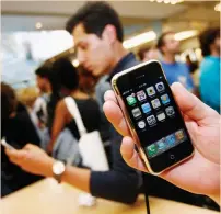  ?? (Shannon Stapleton/Reuters) ?? THE IPHONE is seen inside an Apple Store in New York in 2007. Apple has sold more than one billion iPhones since June 29, 2007.