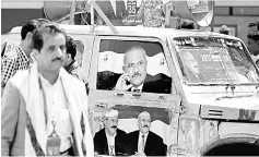  ??  ?? Posters of Saleh are seen on a car at a square where Saleh’s party, the General People’s Congress, is preparing to hold a rally to mark the 35th anniversar­y of its establishm­ent in Sanaa, Yemen. — Reuters photo