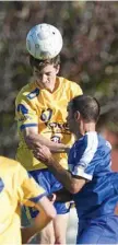  ??  ?? USQ’s Keegan Dixon heads the ball away during his side’s FFA Cup game at the weekend.