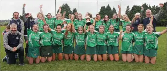  ??  ?? Naomh Eanna celebrate their long overdue Intermedia­te camogie success.