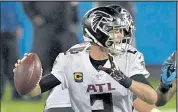  ?? Grant Halverson / Getty Images ?? Falcons quarterbac­k Matt Ryan throws against the Panthers on Thursday at Bank of America Stadium in Charlotte, N.C.