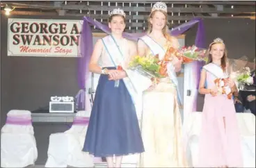  ?? Photo by Amy Cherry ?? The 2021 Elk County Fair Queen Court is Brinley Fedder, fair queen, shown in the center, Helayna Hollobaugh, junior queen, shown on the left, and Angela Brooks, princess, shown on the right.