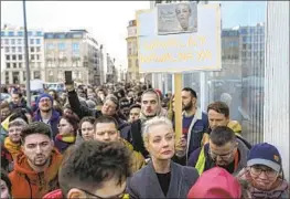  ?? Ebrahim Noroozi Associated Press ?? YULIA NAVALNAYA, center, widow of opposition activist Alexei Navalny, waited five hours in line at a polling station near the Russian Embassy in Berlin.