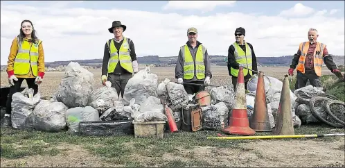  ??  ?? The volunteers were praised for their efforts in removing 87 bags of rubbish from the River Stour - they found 14 traffic cones, seven bike tyres, two large rolls of agricultur­al plastic wrapping and two fire extinguish­ers