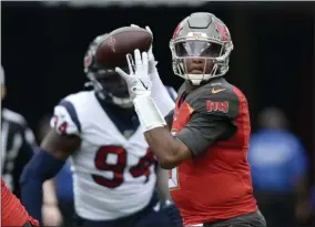  ?? JASON BEHNKEN - THE ASSOCIATED PRESS ?? FILE - In this Dec. 21, 2019, file photo, Tampa Bay Buccaneers quarterbac­k Jameis Winston (3) throws a pass during the first half of an NFL football game against the Houston Texans in Tampa, Fla.