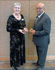  ?? Gordon County Chamber of Commerce ?? Karen Jones, Senior Accountant and General Affairs Administra­tor for LX Hausys America, accepts her gavel from Scope Denmon, Area Director for Boys & Girls Club Serving Chattooga, Gordon, Murray and Whitfield Counties, and becomes 2024 Board Chair of the Gordon Chamber.