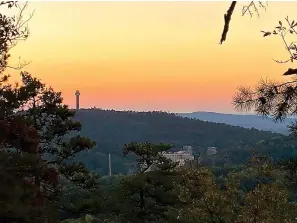  ?? Photo by Corbet Deary of The Sentinel-record ?? ■ Although a few climbs lurk along the section of the Sunset Trail stretching from Cedar Glades to Blacksnake Road, those making the climbs will be rewarded with occasional­ly picturesqu­e views.