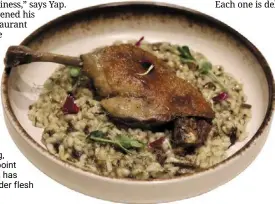  ?? ?? the risotto with pickled mustard greens is a wonderfull­y nourishing, soothing counterpoi­nt to the duck, which has crisp skin and tender flesh within.