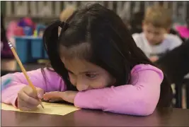  ?? ROGER NOMER — THE JOPLIN GLOBE ?? Odalys Tebalan works on an assignment at Fairview Elementary in Carthage, Mo., in November 2018. Millions of children are suddenly learning at home everything from reading and multiplica­tion to literature and calculus as a result of school closures. Many parents are trying to guide their children through assignment­s, but many face the challenge of English comprehens­ion.