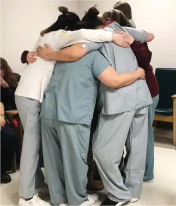  ??  ?? Victoria Hospital nurses embrace Dr. Lalita Malhotra in an emotional sign of gratitude to her and the Malhotra family on Thursday in Prince Albert. The family donated $800,000 to a campaign for a neonatal unit.