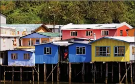  ??  ?? HIGH AND DRY: Homes built on stilts on the mysterious island of Chiloe