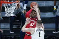  ?? MICHAEL CONROY — THE ASSOCIATED PRESS ?? Ohio State forward E.J. Liddell shoots over Michigan center Hunter Dickinson on March 13 in Indianapol­is.