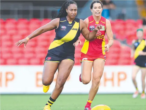  ?? Picture: GETTY IMAGES ?? Richmond’s Sabrina Frederick and Gold Coast’s Lauren Ahrens compete at Metricon Stadium yesterday