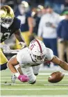  ?? NAM Y. HUH/AP ?? Stanford safety Jonathan McGill, right, recovers a fumble past Notre Dame’s Jayden Thomas on Saturday.