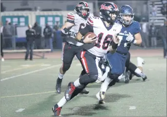  ??  ?? Nikolas Samuels/The Signal
Hart’s JT Shrout (16) takes the ball up the field during a game against Sierra Canyon on Friday.