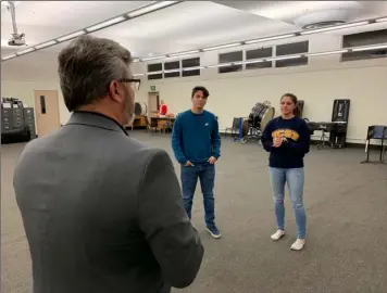  ?? PHOTO RYAN RIGNEY ?? “newsies” director george Scott (foreground) coaches Chase Seals (left) and analia Sotelo (right) with their vocals during a rehearsal.