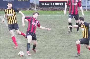  ??  ?? Ash Ross intercepts a Caulfield United pass.