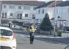  ??  ?? Investigat­ion Part of Penilee Road was cordoned off as police searched the scene
