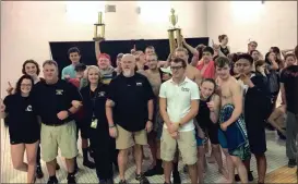  ?? CONTRIBUTE­D PHOTOS ?? ( Calhoun High swimmers and coaches pose for a photo after winning the NWGA Championsh­ip on Saturday. ( Calhoun’s Bo Dyar (from left), Cal Parker, Caleb Black and Joe Kauffman accept the trophy.