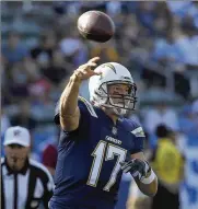  ?? LUIS SINCO / LOS ANGELES TIMES ?? Philip Rivers might not be up on the latest trends, but the Chargers quarterbac­k still knows how to be a good teammate. “It’s my favorite part of the game,” he says.