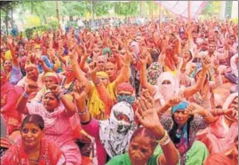  ?? MANOJ DHAKA/HT ?? Women sanitation workers sitting on a dharna outside the MC office in Rohtak on Saturday. They have extended their strike till May 14 to press for demands, including job regularisa­tion, equal wage for equal work and 100 sq feet land to build house.