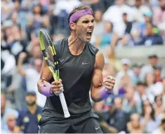  ??  ?? Rafael Nadal reacts after scoring a point against Daniil Medvedev during the men’s singles final of the U.S. Open in New York. Nadal and other top players have expressed reservatio­ns about traveling to what has been a hot spot for the COVID-19 outbreak.