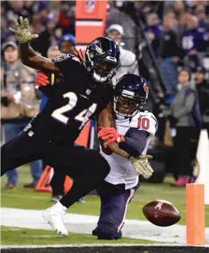  ?? | AP ?? The Ravens’ Brandon Carr breaks up a pass intended for the Texans’ DeAndre Hopkins.