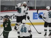  ?? STACY BENGS — THE ASSOCIATED PRESS ?? San Jose’s Mario Ferraro (38) hugs teammate San Jose’s Brent Burns (88) in celebratio­n after Burns scored a goal in the third period of an NHL hockey game against the Minnesota Wild, Sunday, in St. Paul, Minn.