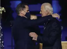  ?? AP fiLe ?? FATHER AND SON: President-elect Joe Biden, right, embraces his son Hunter Biden, left, in Wilmington, Del. Hunter Biden says he has learned from federal prosecutor­s that his tax affairs are under investigat­ion.