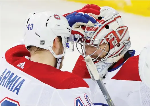  ?? JULIE JACOBSON/THE ASSOCIATED PRESS ?? Joel Armia, who scored a hat trick, celebrates Friday night’s 4-2 win over the New York Rangers with Habs goalie Carey Price, who made 28 saves.
