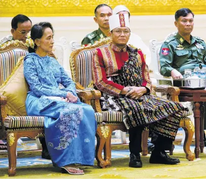  ?? PHOTO: REUTERS ?? Power shift . . . Aung San Suu Kyi (left) and vicepresid­ents Henry Van Thio (second left) and Myint Swe attend the handover ceremony from outgoing President Thein Sein and new Myanmar President Htin Kyaw at the presidenti­al palace in Naypyitaw in 2016.
