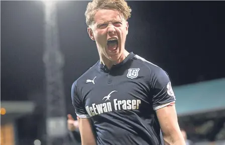  ??  ?? Mark O’Hara celebrates after finding the net, not once but twice, against Rangers at Dens Park last Friday.