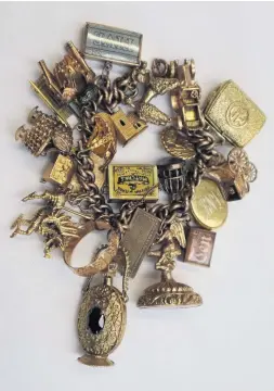  ??  ?? A yellow metal charm bracelet – old at Anthemion Auctions for £2,000