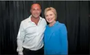  ?? ANDY KHAWAJA VIA AP ?? This image from the website of Allied Wallet CEO Ahmad “Andy” Khawaja shows Khawaja posing with Hillary Clinton. Records obtained by The Associated Press show that Khawaja, a prominent political donor has helped pornograph­ers, payday loan debt collectors and offshore gambling operations get past the gates of the banking system. Los Angeles-based Allied Wallet, its executives and Khawaja have given $6 million in campaign contributi­ons to Republican­s and Democrats since late 2015. The records show the company used fake websites and foreign dummy corporatio­ns to mask some customers’ true business.