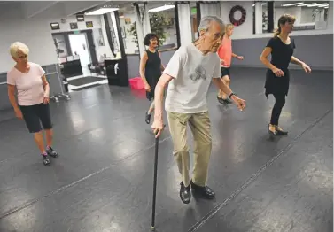  ?? RJ Sangosti, The Denver Post ?? Gene GeBauer, 83, teaches a tap class at Destinatio­n Dance in Wheat Ridge.