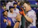  ?? LAURENCE KESTERSON — THE ASSOCIATED PRESS ?? The Mets’ Jay Bruce (19) is congratula­ted in the dugout after hitting a home run off Phillies pitcher Jerad Eickhoff in the fourth inning Monday in Philadelph­ia.