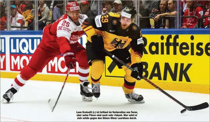  ??  ?? Leon Draisaitl (r.) ist brillant im Vorbereite­n von Toren, aber seine Pässe sind auch sehr riskant. Hier setzt er sich schön gegen den Dänen Oliver Lauridsen durch.