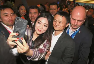  ??  ?? Star of the show: Attendees crowding around Ma for a selfie during the Global Transforma­tion Forum 2017 at Kuala Lumpur Convention Centre.