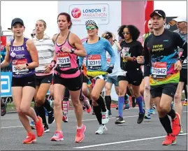  ??  ?? BOOST: Runners in last year’s London Marathon raised millions for charity