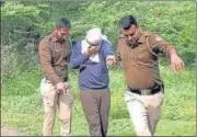  ?? ANI ?? Delhi Police bring the accused to the jungle area to recover body body parts of the victim on Tuesday.