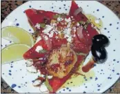  ?? ALYCE MANTIA/SPECIAL TO THE COMMERCIAL APPEAL ?? Watermelon-scallop salad is a delicious first- course treat, but don’t forget to use good balsamic vinegar.