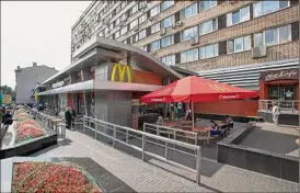  ?? Associated Press ?? Mcdonald’s says it has started selling its Russian business, which includes 850 restaurant­s that employ 62,000 people. The fast-food giant pointed to the humanitari­an crisis caused by the war. The oldest of Moscow’s Mcdonald’s outlets, which opened in 1990, is shown.