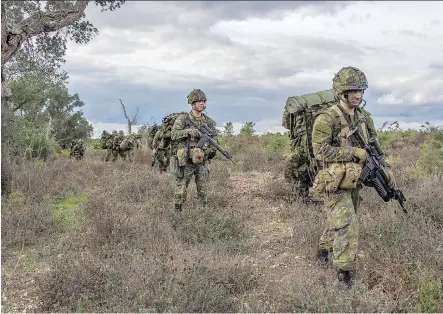  ?? MASTER CPL. JONATHAN BARRETTE/ CANADIAN FORCES COMBAT CAMERA ?? The Van Doos conduct a foot patrol during an exercise in Santa Margarida, Portugal, last Thursday. Canada is part of the Operation Trident Juncture NATO training, involving tens of thousands of troops across Europe.